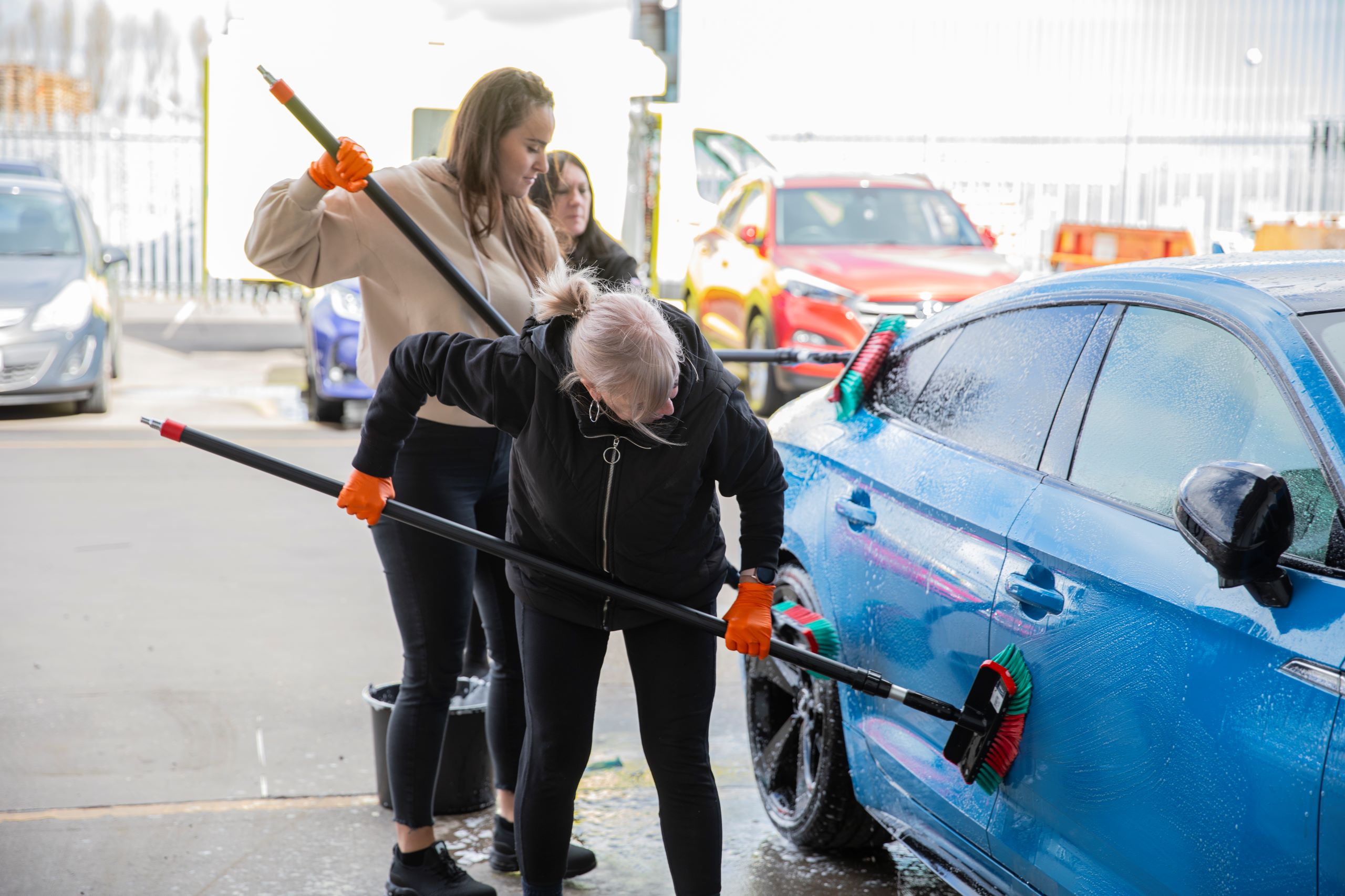 O&H valeting team washing a staff members vehicle as part of our fundraising campaign for Yorkshire Air Ambulance. 