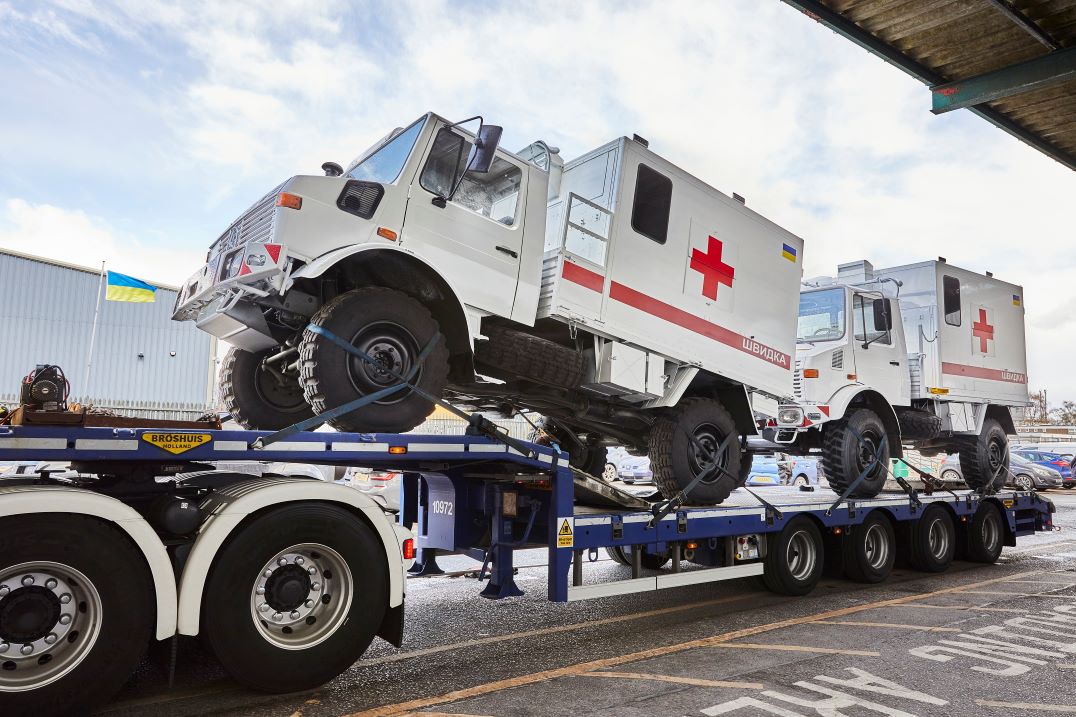 Unimog being loaded on to lorry for delivery